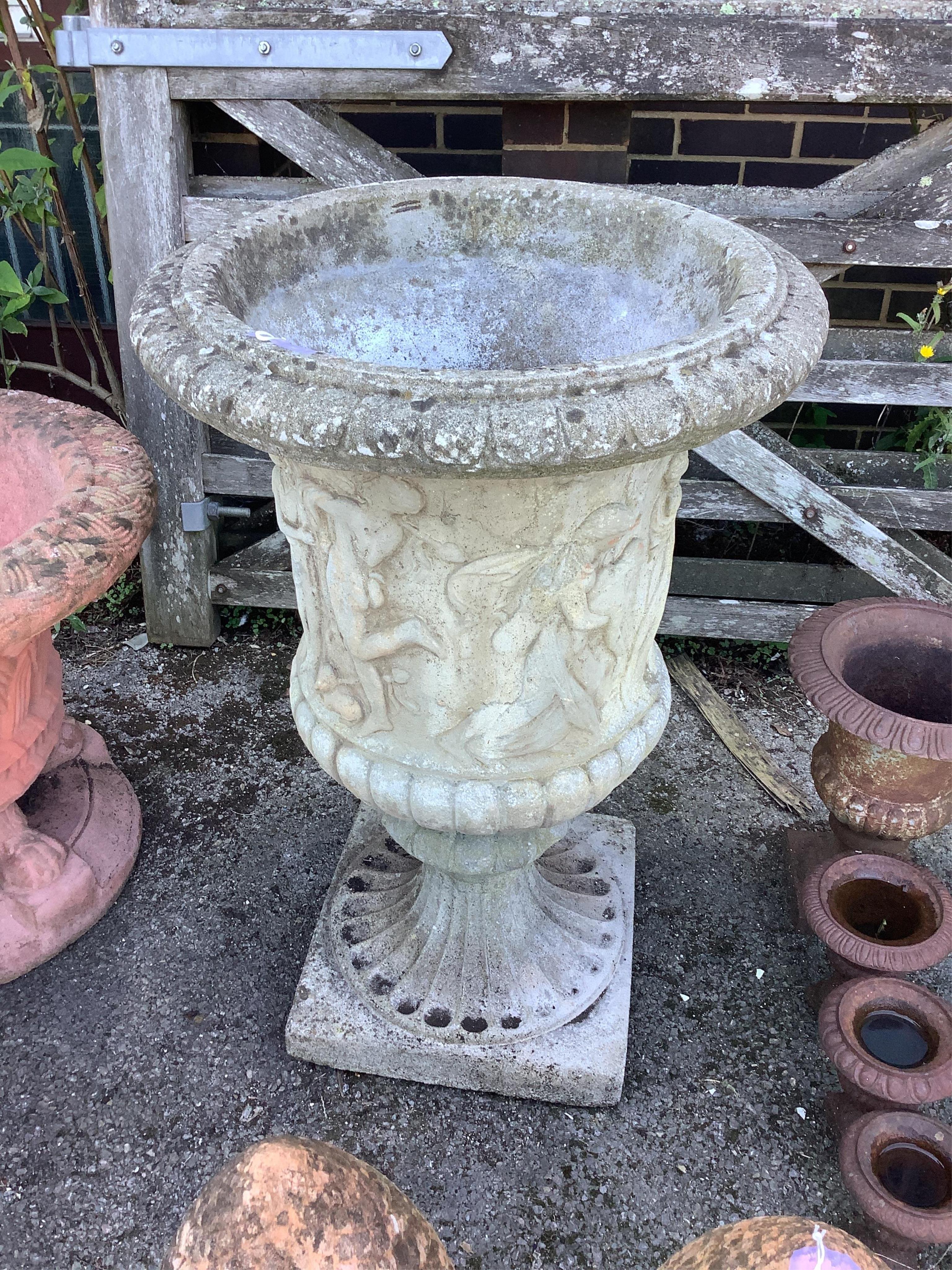 A reconstituted stone campana garden urn, diameter 61cm, height 93cm. Condition - fair